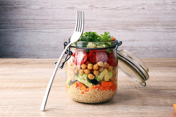 Homemade salad in glass jar with quinoa and vegetables. Healthy food, diet, detox, clean eating and...