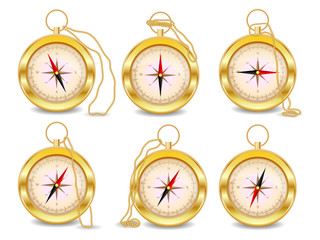 A set of six gold compasses with a wind rose on a gold chain. North, south, west, east, geography, coordinates, directions