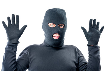 male robber held up his hands, in black clothes