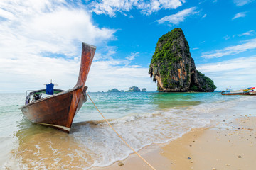 Fototapeta na wymiar Sunny day, seascape coast of Thailand resort and traditional boats