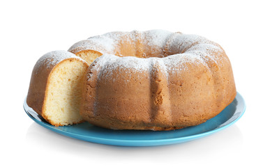 Blue plate with sliced yogurt cake on white background