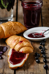 Breakfast: croissants, black currant jam, berries and basil