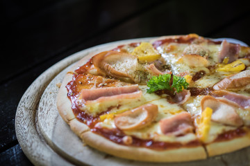  Delicious home made Hawaiian pizza on wooden plate