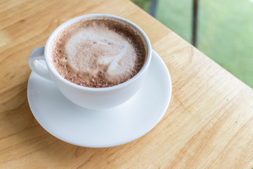 hot coffee mocha with foam milk in countryside cafe