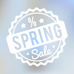 Spring Sale rubber stamp white on a lila bokeh background.
