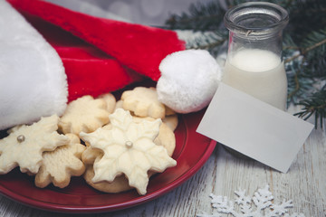 Obraz na płótnie Canvas Christmas Cookies for Santa with Blank note Card