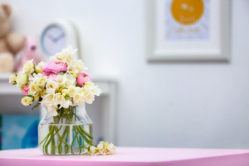 Beautiful bouquet with white freesia flowers on table at home
