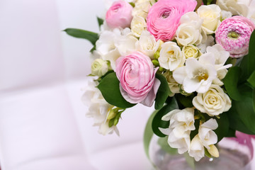 Beautiful bouquet with freesia flowers on white blurred background