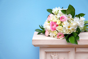 Beautiful bouquet with white freesia on mantelpiece