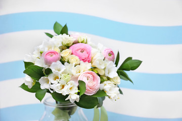 Beautiful bouquet with white freesia on color background