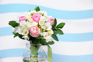 Beautiful bouquet with white freesia on color background