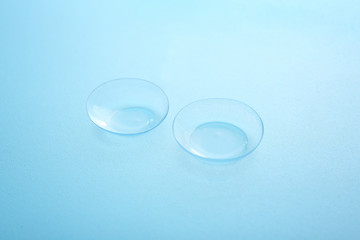 Contact lenses on color background