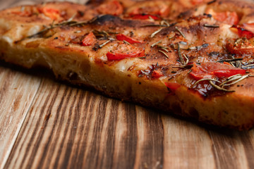 Focaccia with tomatoes on the table
