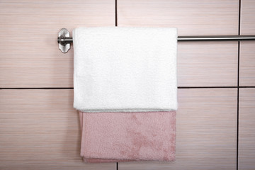 Clean towels on hanger in bathroom