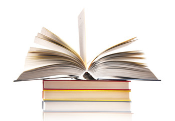 Composition with stack of books isolated on white
