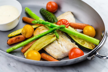 Grilled fish and vegetables with sauce