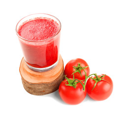 Glass of smoothie and fresh tomatoes on white background