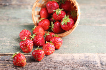 Fresh strawberries on grey wooden table