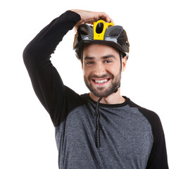 Handsome young bicycle rider with helmet on white background