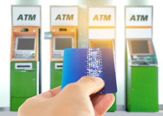 male,female use cell phones blurred images in Blurred of ATM machine in Department store.