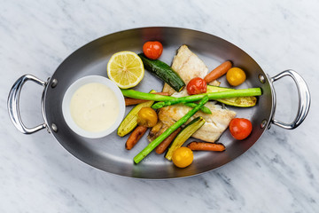 Grilled fish and vegetables with sauce