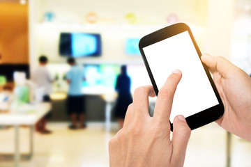 Man use mobile phone with blur image of counter service background.
