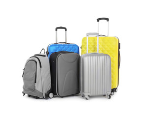 Pile of different heavy luggage on white background. Overweight concept