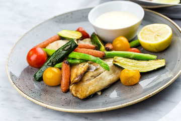Grilled fish and vegetables with sauce