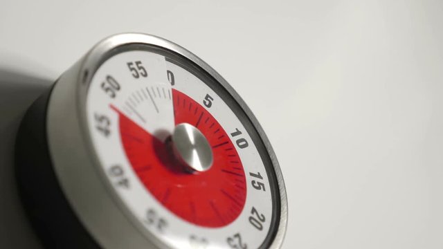 Classical vintage kitchen countdown timer close up, 60 minutes in 20 seconds time lapse shot