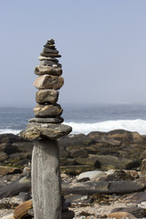 Rock Stacking by the Ocean