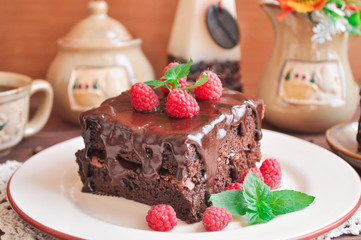Chocolate cake Brownie with raspberries and tea