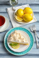 Piece of delicious lemon meringue pie on plate