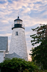 Fototapeta na wymiar Sunset over Dice Head lighthouse in Castine, Maine, a famous area where many wars were fought for control of this strategic military region.