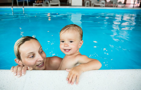 Baby with mom in the pool