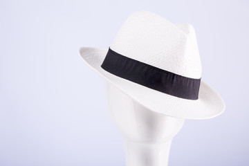 White straw hat on the head of a dummy