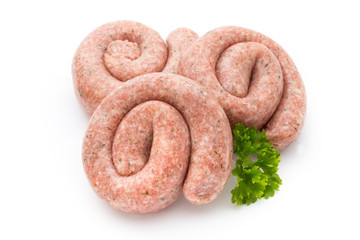 Raw sausages with herbs and spices.