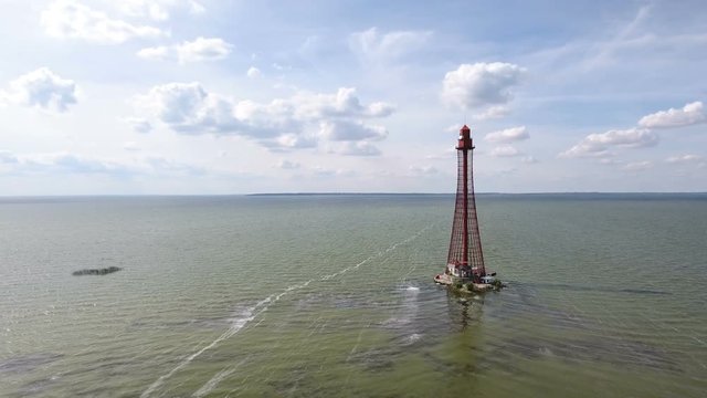 Gorgeous bird`s eye shot of a metal frame light house near Dzharylhach island, its shoal in the Black sea from a low flying drone. The seascape looks great and gorgeous