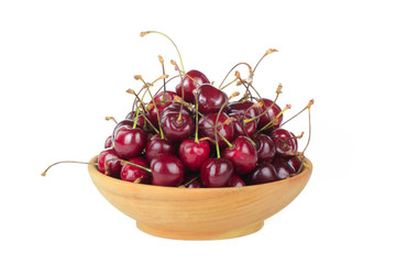 cherry with leaves in wooden plate isolated