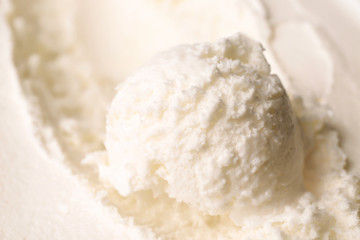 Fototapeta na wymiar Tasty homemade vanilla ice cream scoop, closeup