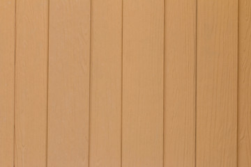 Wooden rake. Texture, background. Wooden plank on the wall of the house.
