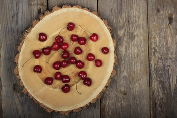 Fresh garden cherry in wooden table