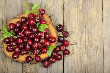 Fresh garden cherry in wooden table