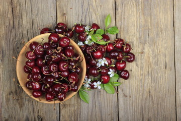 Fresh garden cherry in wooden table