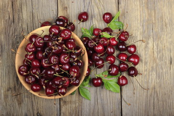 Fresh garden cherry in wooden table