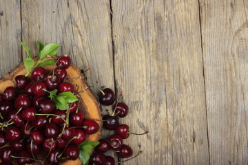 Fresh garden cherry in wooden table