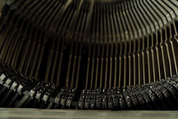 Old black typewriter with round keys