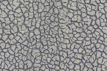 Background from old weathered faded cardboard with a relief from cracks