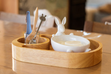 Pudding in rabbit cup on wood board