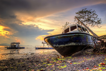 Sunrise and sunset view with boat