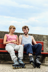 Fototapeta premium Young people friends relaxing on bench.